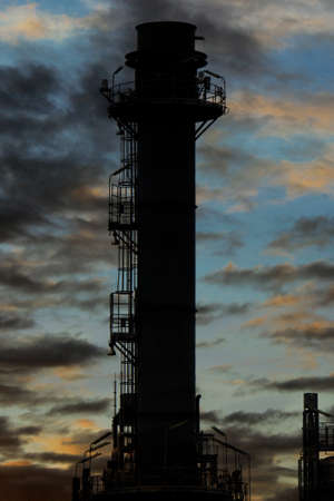 Silhouette Natural Gas Combined Cycle Power plant electricity generating station of industry in sunset sky.の写真素材