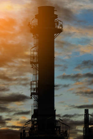 Silhouette Natural Gas Combined Cycle Power plant electricity generating station of industry in sunset sky.の写真素材
