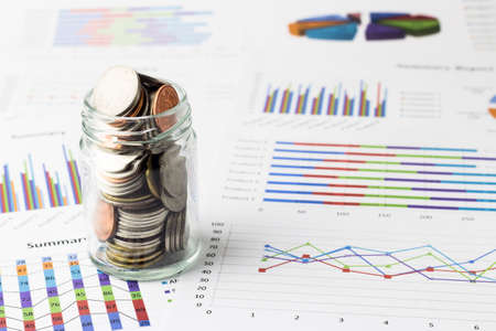 Money coins on business account in the background.の写真素材