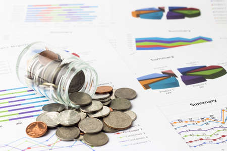 Money coins on business account in the background.の写真素材