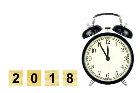 New years 2018 concept with alarm clock and wooden number 2018 isolated on white background.