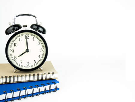 Back to school concept with Alarm clock and book.の写真素材