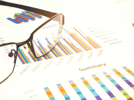 Business chart by unfocused glasses, Financial concept.の写真素材