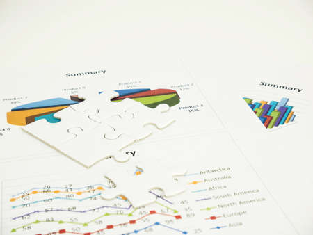 Jigsaw puzzle on business graph background, business concept.