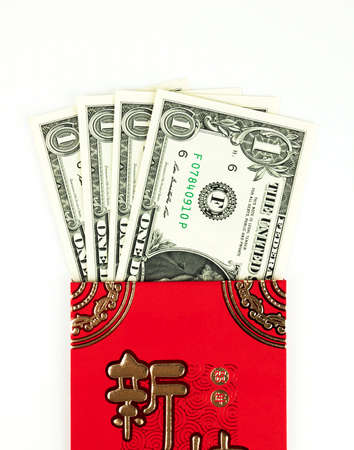 Red envelope isolated on white background with dollar money for gift Chinese New Year. Chinese text on envelope meaning Happy Chinese New Year.の写真素材