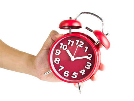 Male hand holding red alarm clock isolated on white background, Clipping pathの写真素材