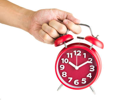 Male hand holding red alarm clock isolated on white background, Clipping pathの写真素材