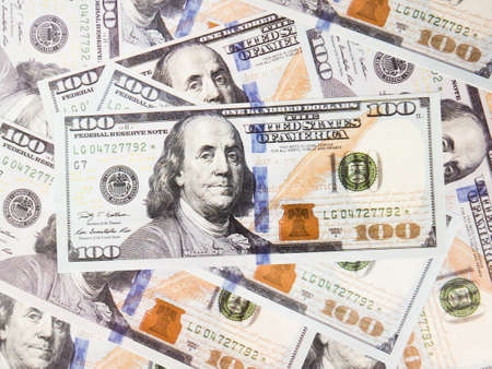 It is a lot of One hundred dollars banknotes pile as background.
