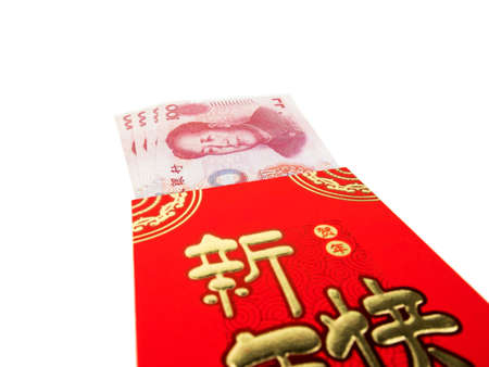 Chinese or 100 Yuan banknotes money in red envelope isolated on white background, Chinese text on envelope meaning Happy Chinese New Yearの写真素材
