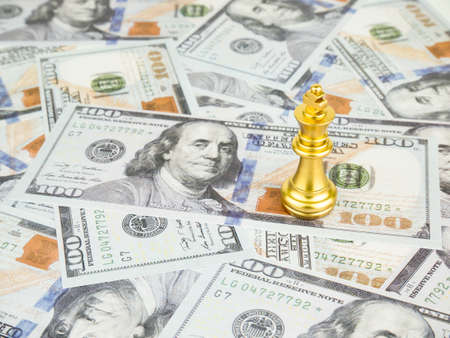 Gold King of chess on dollar banknote background, Business success concept.の写真素材