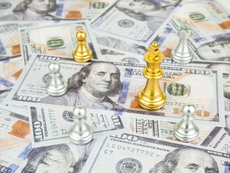 Gold King of chess on dollar banknote background, Business success concept.の写真素材