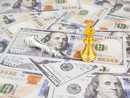 Gold King of chess on dollar banknote background, Business success concept.