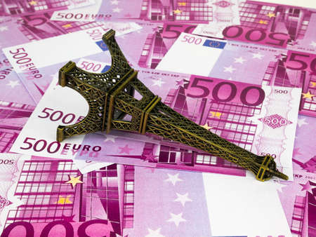 Five hundred 500 Euro bills banknotes with Eiffel tower replica, European currency money background.の写真素材