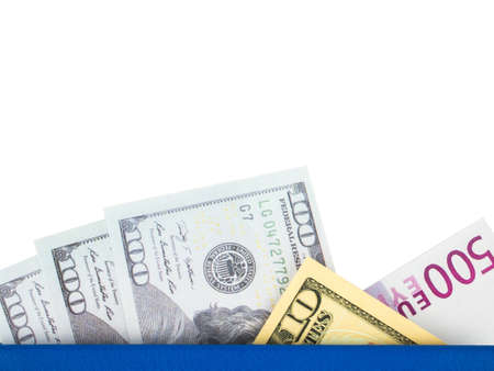 Blue book with nested international banknotes, isolated on white background. Stash of money concept, Business ideasの写真素材
