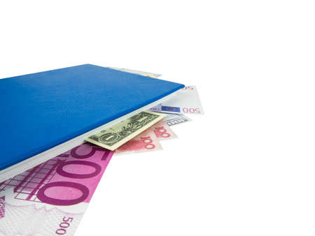 Blue book with nested international banknotes, isolated on white background. Stash of money concept, Business ideas, Clipping path.の写真素材