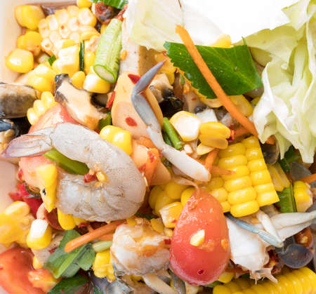 Spicy papaya corn salad with shrimp and fresh crab, Papaya corn salad is the most popular of women in Thailand.の写真素材
