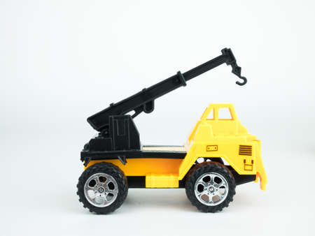 Toy truck crane on white background, Engineering construction concept.