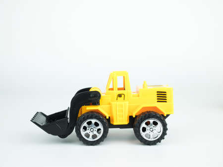 Toy bulldozer on white background, Engineering construction concept.の写真素材