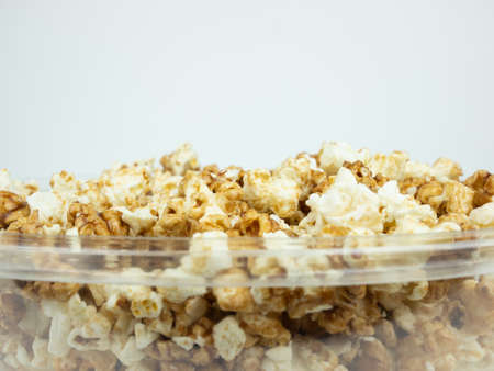 Popcorn in bowl on white background.の写真素材
