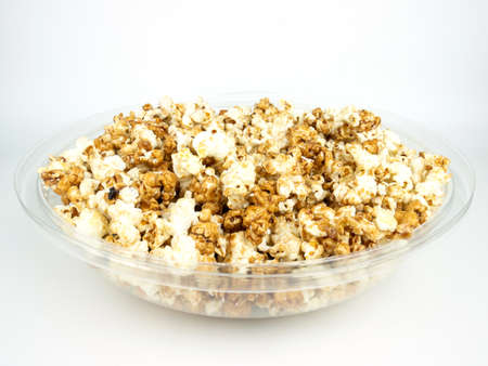Popcorn in bowl on white background.の写真素材