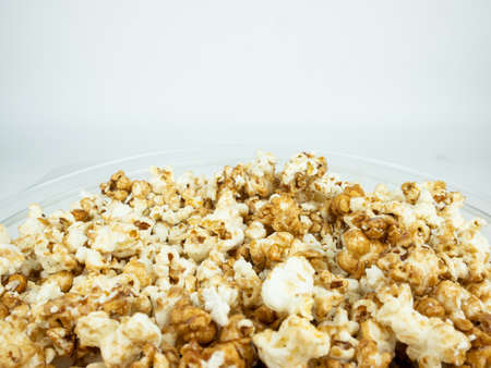 Popcorn in bowl on white background.の写真素材
