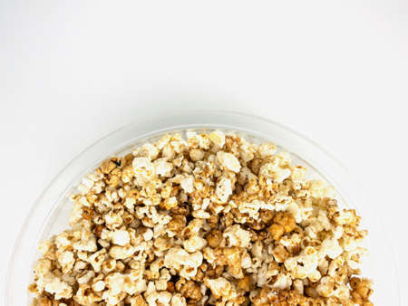Popcorn in bowl on white background.の写真素材
