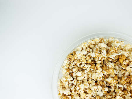 Popcorn in bowl on white background.の写真素材