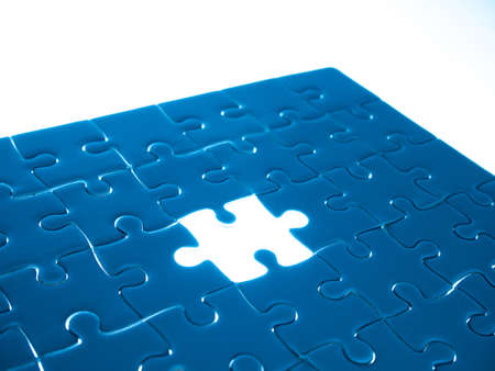 Missing Jigsaw puzzle piece with lighting, business concept for completing the finishing puzzle piece.の写真素材
