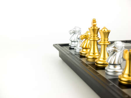 Gold and Silver King and Knight of chess piece setup on white background . Leader and teamwork concept for success.の写真素材