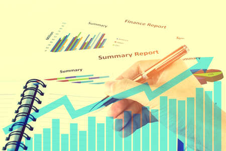 Double exposure Pen in the man's hand, Finances and analysis of the market concept.の写真素材