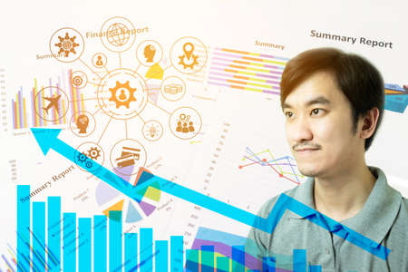Double exposure of young Asian man thinking with Chess board versus Finance graph chart, Financial strategy concept, Business concept.の写真素材