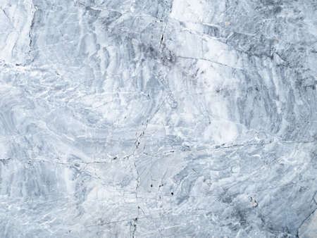 The surface of the light gray marble stone texture background. More then a million years old.