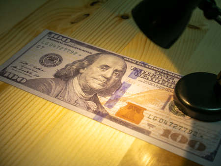 American dollars and light lamp.の写真素材