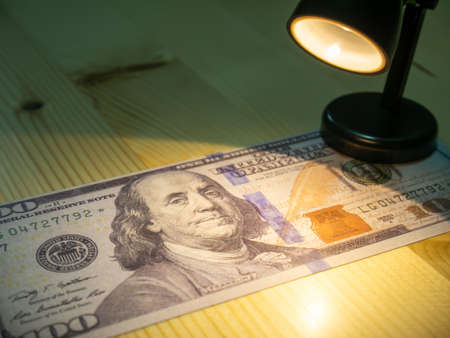 American dollars and light lamp.の写真素材