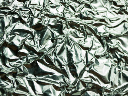Silver foil with shiny crumpled texture background.の写真素材