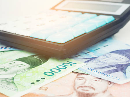 South Korea won banknote currency close up macro with calculator, Korean money.の写真素材