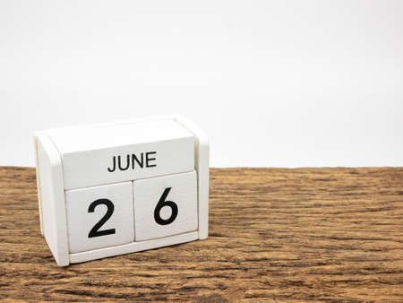 June 26 white cube wooden calendar on vintage wood and white background with Summer day, Copyspace for text; International Day Against Drug Abuse.の写真素材