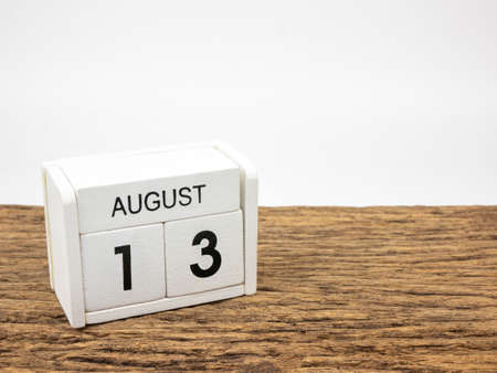 August 13 white cube wooden calendar on vintage wood and white background with summer day, Copyspace for text.の写真素材
