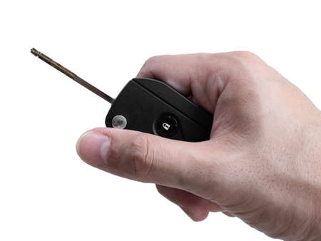 Man hand holding a car key remote isolated on white background, Clipping pathの写真素材