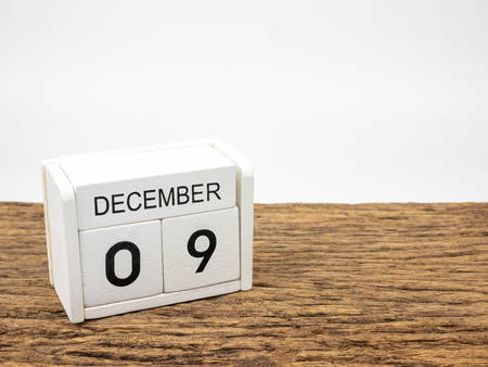 December 9 white cube wooden calendar on vintage wood and white background with winter day, Copyspace for text, International Anti-Corruption Day.の写真素材