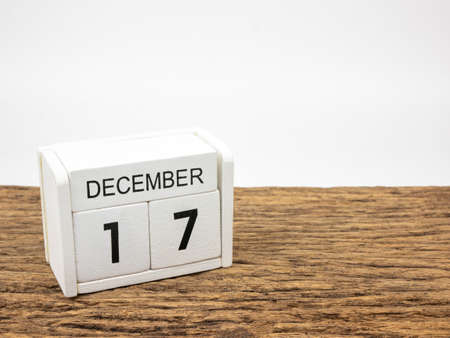 December 17 white cube wooden calendar on vintage wood and white background with winter day, Copyspace for text.の写真素材