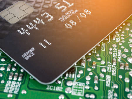 Technology credit card on printed board circuitの写真素材