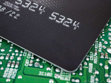Technology credit card on printed board circuitの写真素材
