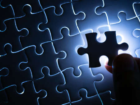 Missing Jigsaw puzzle piece with lighting, Business concept for completing the finishing puzzle piece.の写真素材