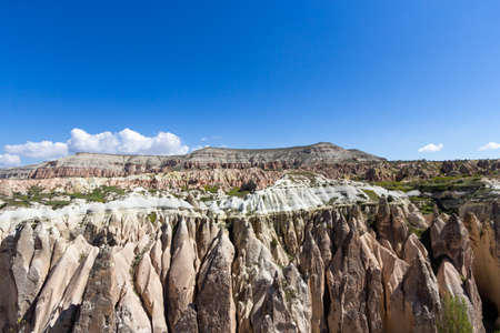 Cave town and rock formations in Zelve Valley, Cappadocia, Turkey.の写真素材