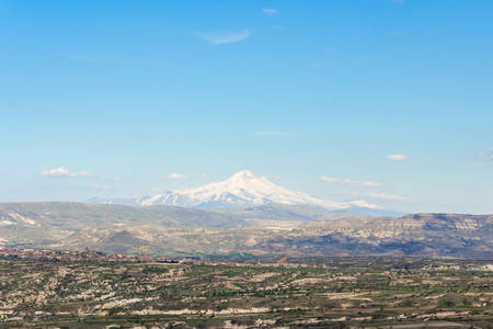 View of the Mount Erciyes ( Turkish: Erciyes Dagi ) from Uchisar Castle in Cappadocia Region. Also known as Argaeus, is a volcano in Turkey.の写真素材