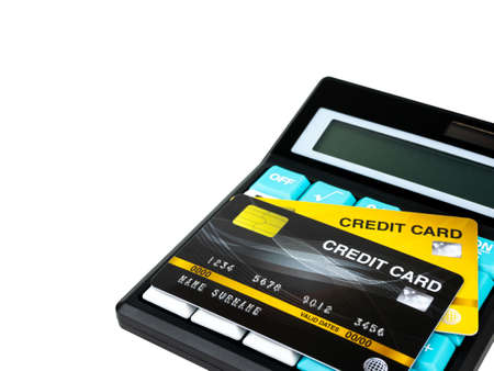 Credit card on calculator isolated on white background.の写真素材