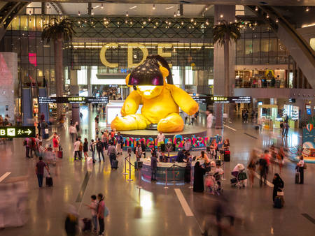DOHA, QATAR - MAY. 31, 2019: Yellow Lamp bear at Hamad International Airport.のeditorial素材