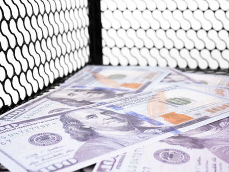 Dollars money in a mouse trap on white background