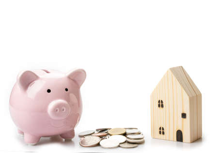 Piggy bank, coins, Home loans saving with financial planning concept, Isolated on white background.の写真素材
